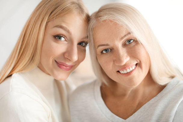 Portrait of beautiful mother and daughter - Photo, Image