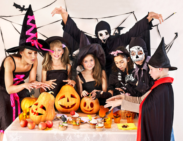 Halloween party with children holding trick or treat. - Φωτογραφία, εικόνα