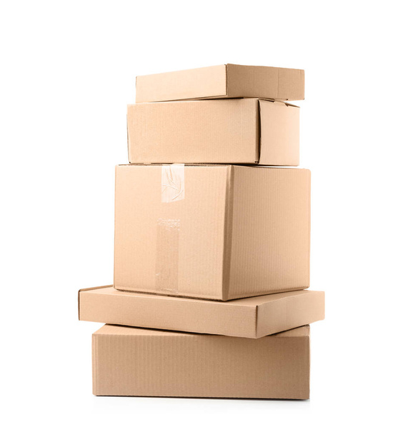 Stack of cardboard boxes on white background - Foto, afbeelding