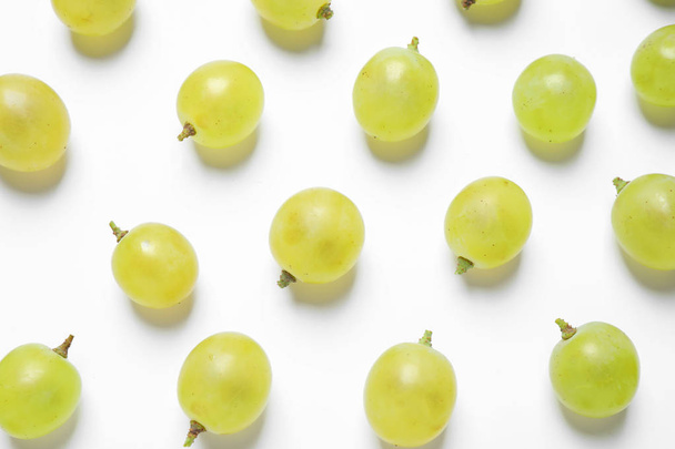 Fresh ripe juicy grapes on white background, top view - Foto, imagen