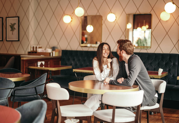 Happy couple flirting in cafe - Zdjęcie, obraz