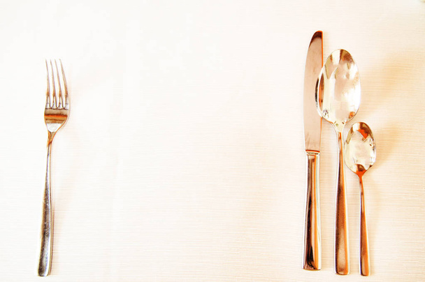World food day concept, white tablecloth and Cutlery without food, copy space top view, bright glare - Fotoğraf, Görsel