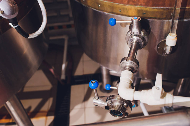 Craft beer brewing equipment in brewery Metal tanks, alcoholic drink production. - 写真・画像