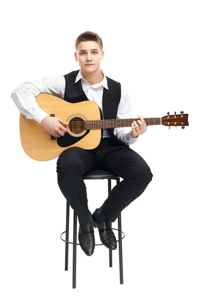 Young man playing on guitar - Foto, Imagem