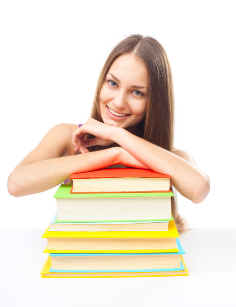 Smiling student girl with pile of books - Photo, image