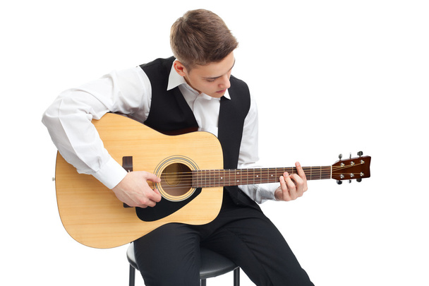 Young man playing on guitar - Foto, immagini