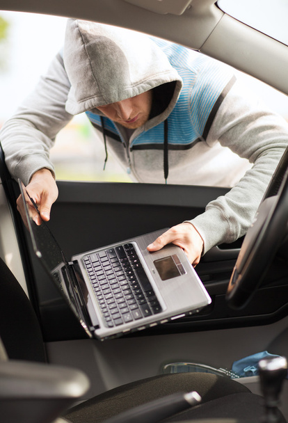 Thief stealing laptop from the car - Fotografie, Obrázek