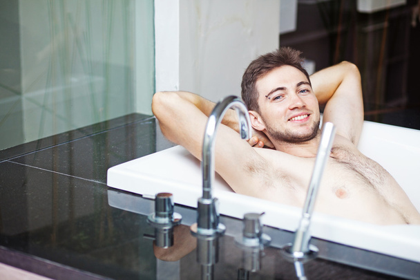 Man taking bath - Фото, изображение