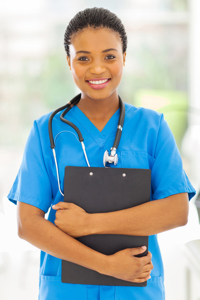 female african medical nurse holding clipboard - Foto, Imagen
