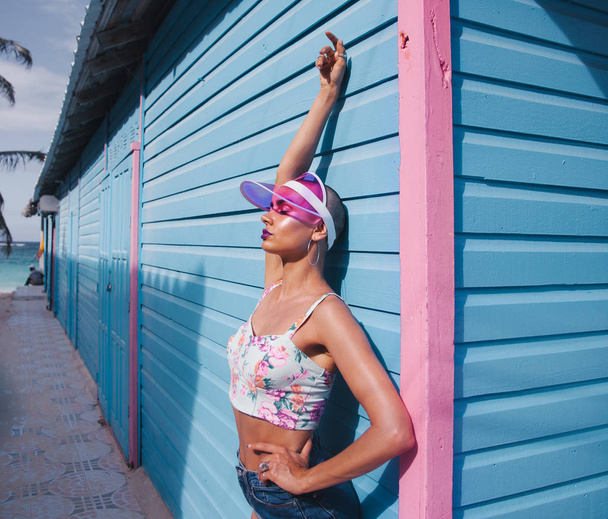 fashion girl on a background of blue wall - Valokuva, kuva