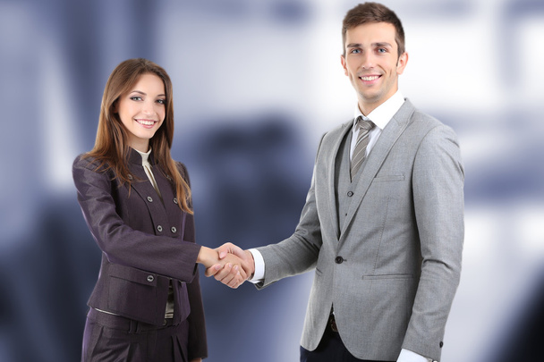 Business colleagues shaking hands at office - Foto, Imagen