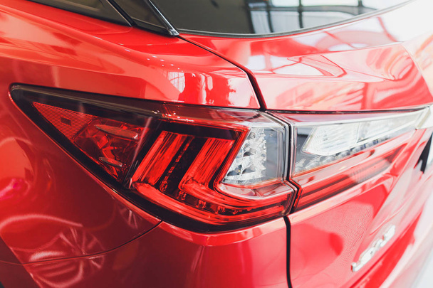 Detail on the rear light of a red car. - Fotó, kép