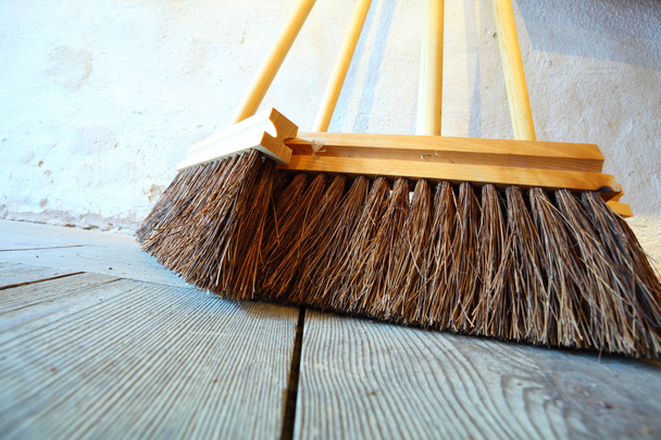 large brooms on wooden floor housework - Foto, immagini
