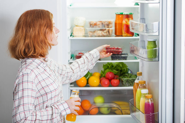 teenager girl at fridge with food - Zdjęcie, obraz