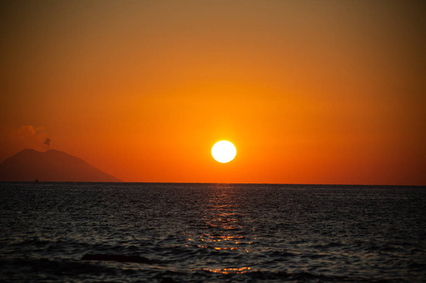 Smoking Stromboli in the sunset - Photo, Image