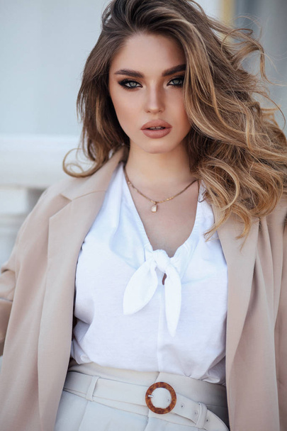 beautiful woman with blond hair in elegant clothes and accessori - Zdjęcie, obraz