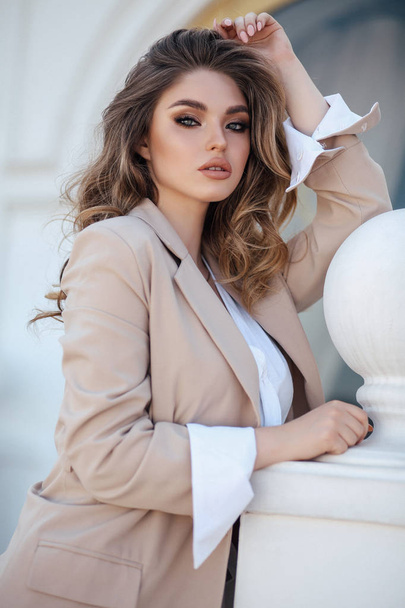 beautiful woman with blond hair in elegant clothes and accessori - Fotó, kép
