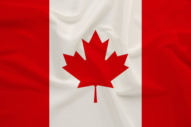 Canada national flag on gentle silk with wind folds, travel concept, immigration, politics - Foto, imagen