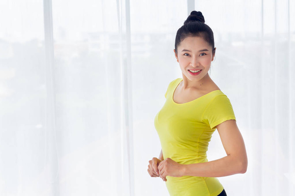 Portrait of Beautiful Asian woman is prepared to exercise yoga i - Photo, Image
