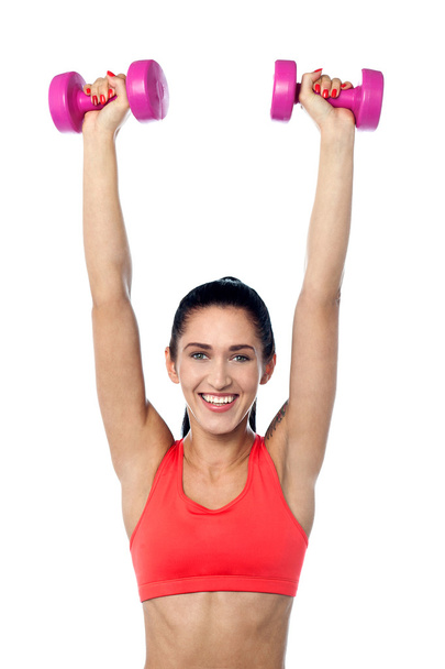 Happy fitness woman lifting dumbbells - Foto, Imagem