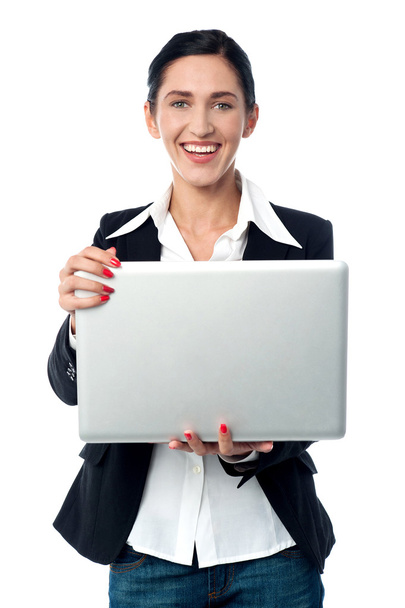 Corporate woman holding laptop - Zdjęcie, obraz