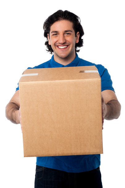 Man carrying cardboard box - Foto, Imagen