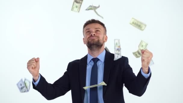 Slow motion of formally dressed man is delighted with the fact that a lot of dollar bills are fall on him - Filmmaterial, Video