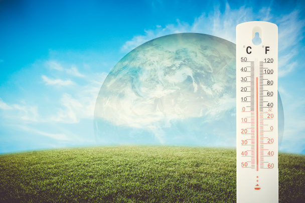 Thermometer check the earth's temperature with impact of global  - Photo, Image