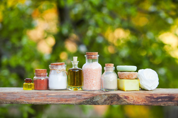 Wooden shelf with organic cosmetics close up outdoors - Zdjęcie, obraz