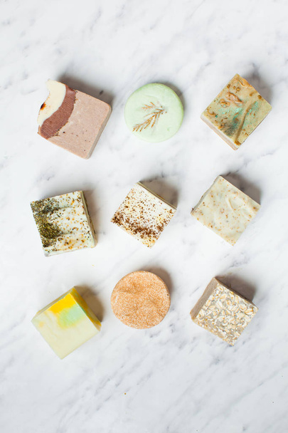 top view of various handcrafted soap and solid shampoo - 写真・画像