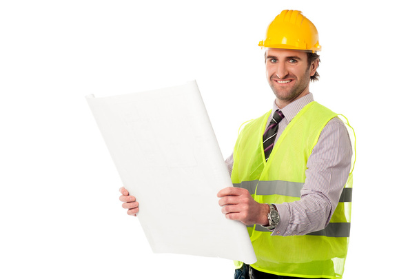 Male construction worker holding blueprint - Фото, зображення