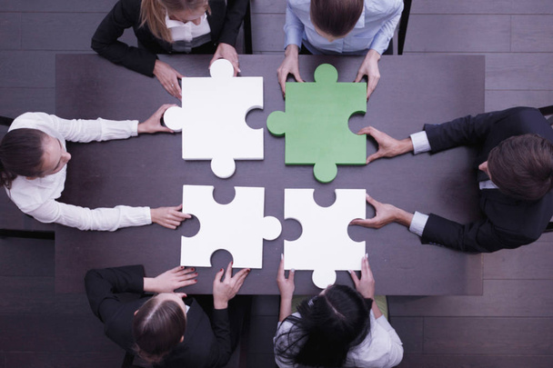 Business people assembling puzzle - Photo, Image