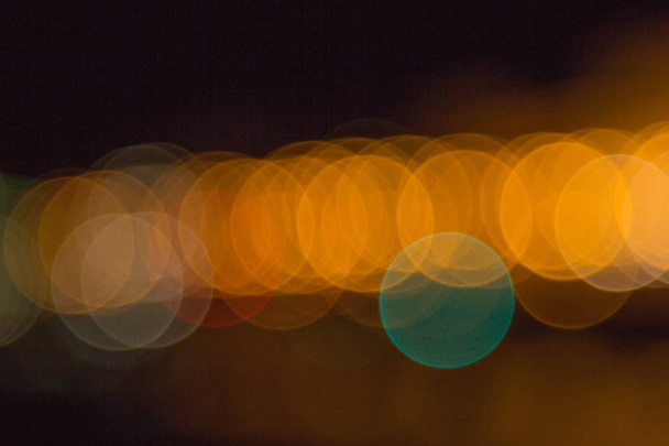 blurry lights of a big city at night. Background for travel photos. bokeh advertising poster - Zdjęcie, obraz