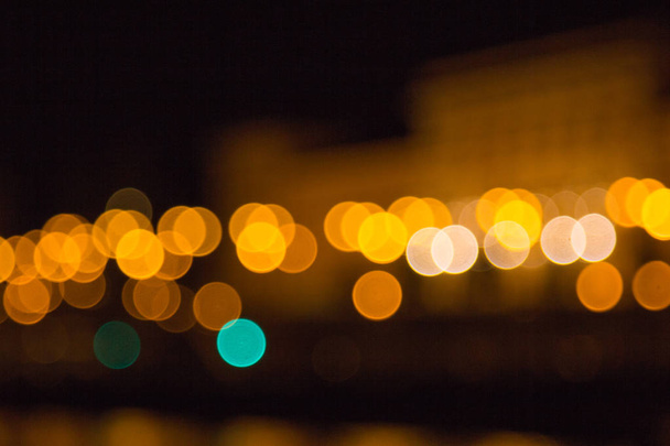 blurry lights of a big city at night. Background for travel photos. bokeh advertising poster - 写真・画像
