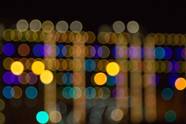 blurry lights of a big city at night. Background for travel photos. bokeh advertising poster - Foto, Imagen