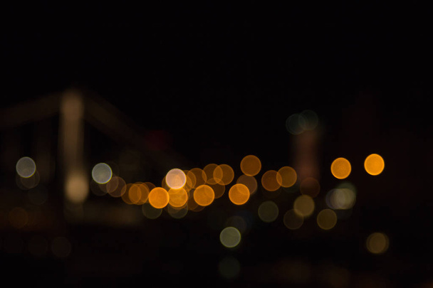 blurry lights of a big city at night. Background for travel photos. bokeh advertising poster - Foto, Imagen