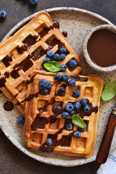 Belgian waffles for breakfast with chocolate sauce - Фото, изображение