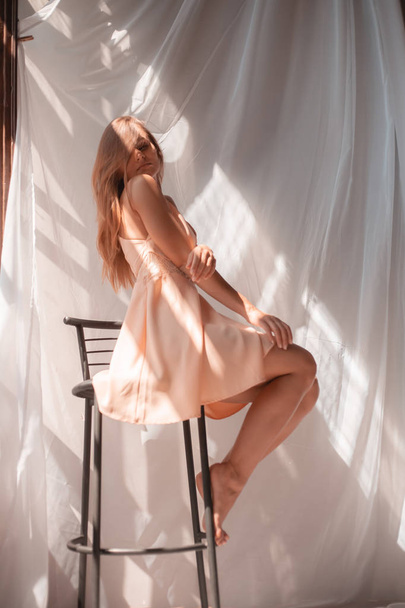 Beautiful blonde model posing in the studio. Delicate style feminine. - Foto, Bild