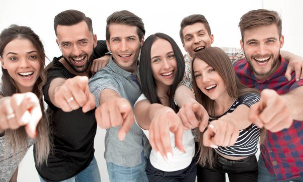 close up.a fun team of young people pointing at you - Фото, зображення