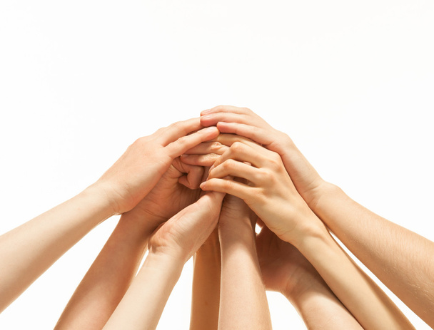 Successful team: many hands holding together - Фото, изображение