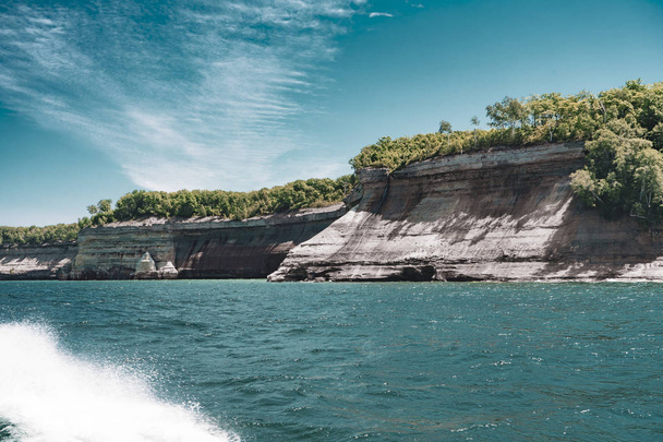 view from the lake at beautiful rocky cliff and forest , Pictured Rocks National Lakeshore - Foto, immagini