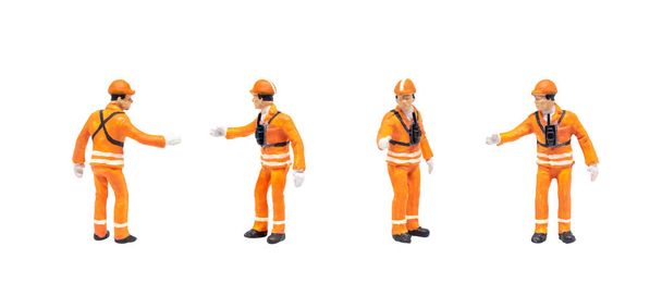 Group of Miniature figurine character as railway shunter standing and posing in posture isolated on white background. - Photo, Image