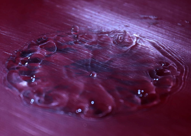 bizarre patterns on the surface of the liquid after hitting a drop of water - Photo, image