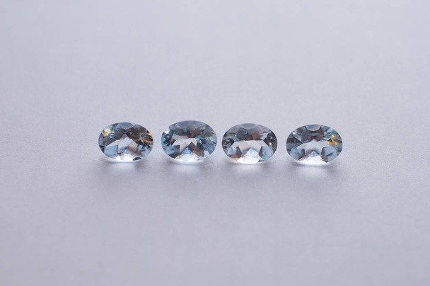 Natural faceted blue aquamarine on the white background - Photo, Image