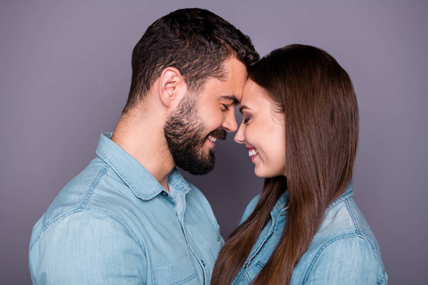 Close-up profile side view portrait of two her she his he nice attractive charming lovely careful gentle sweet cheerful cheery person cuddling touching isolated over gray pastel background - Φωτογραφία, εικόνα