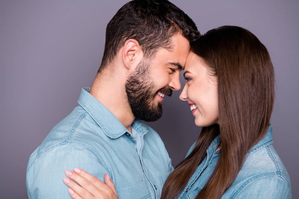 Close-up profile side view portrait of two her she his he nice attractive charming lovely affectionate careful sweet cheerful cheery person embracing cuddling isolated over gray pastel background - 写真・画像