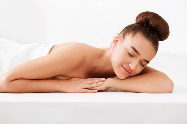 Spa and wellness. Woman relaxing with closed eyes - Photo, Image