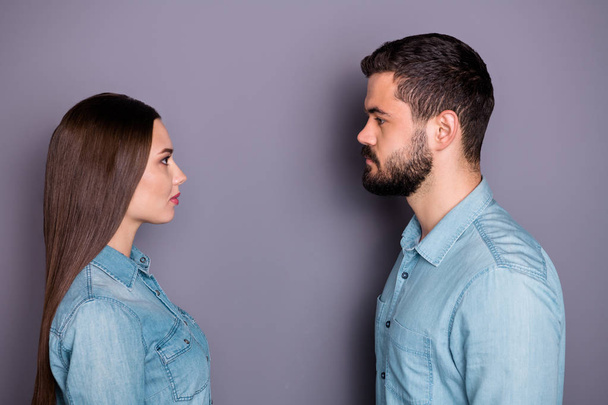 Close-up profile side view portrait of two her she his he nice attractive charming lovely confident content serious person looking at each other isolated over gray violet purple pastel background - Foto, Bild
