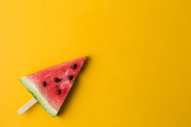 Watermelon slice on a ice cream stick - 写真・画像