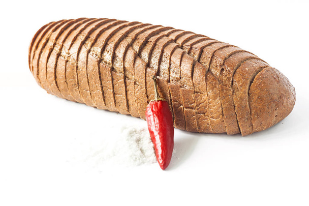 Rye bread with red chili peppers and salt on a white background isolated. - Photo, Image